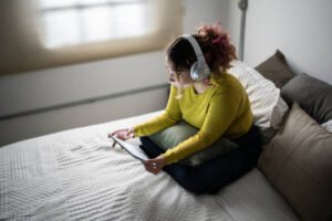 Young woman using a digital tablet at home